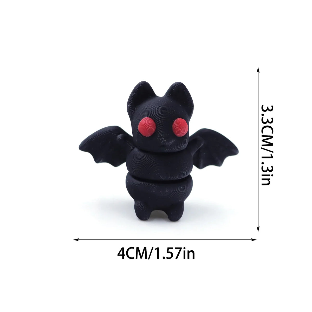 A black 3D printed cartoon animal figurine with large red eyes and wings.