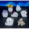 A collection of seven cute luminous ghost resin ornaments in various colors and shapes displayed on a dark surface.