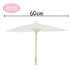 Two white decorative paper parasols or umbrellas with a 60cm span.