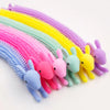 A colorful set of funny stretch sensory fidget toys in various shades of purple, pink, yellow, and green.