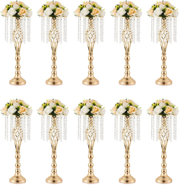 A set of gold crystal vases used for wedding centerpieces, featuring floral arrangements.