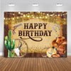 A rustic western backdrop featuring a barn door, cacti, a guitar, and an old revolver with string lights.
