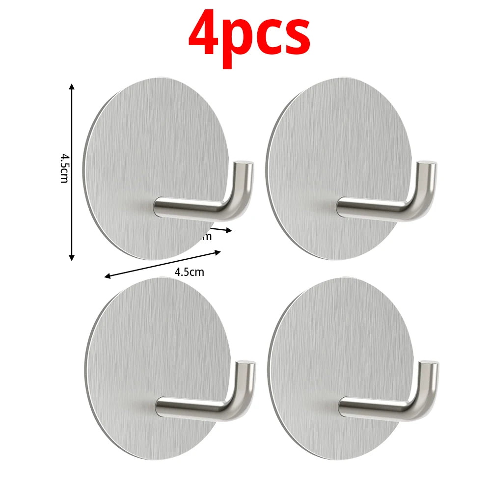 Four round stainless steel self-adhesive wall hooks for bathroom and kitchen use