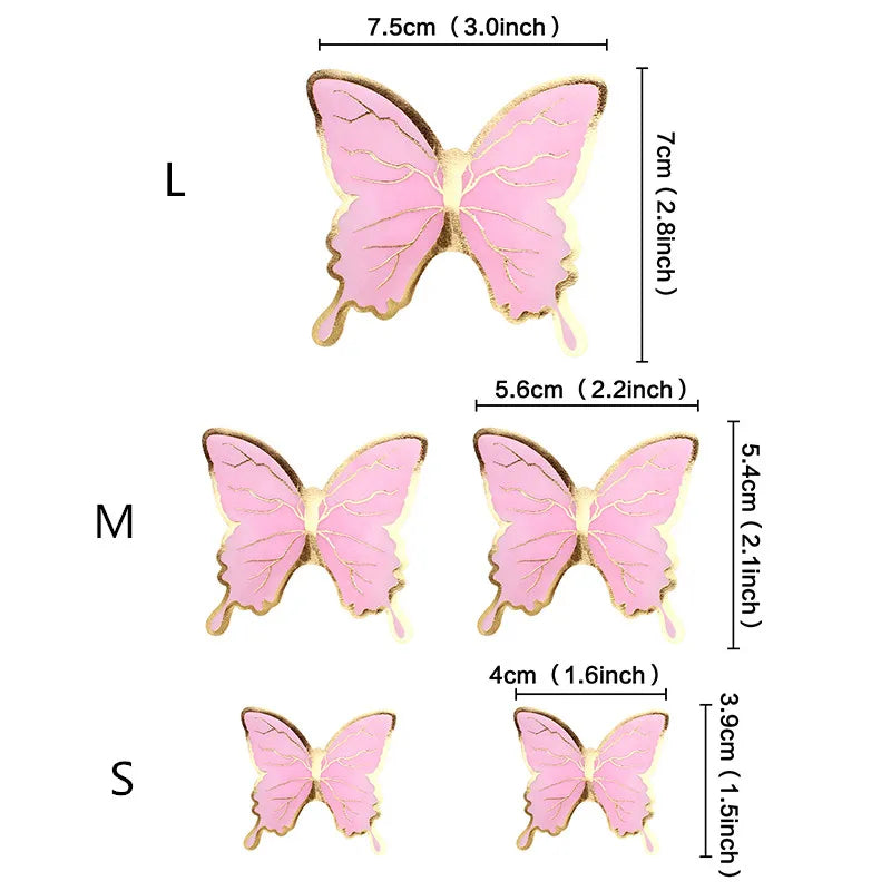 Three butterfly cake toppers in pink and gold, varying in size.
