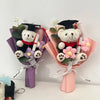 A handcrafted crochet flower bouquet featuring a teddy bear wearing a graduation cap and gown.