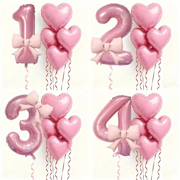 A set of pink heart-shaped number balloons 1, 2, 3, and 4 with bows and streamers for party decoration.