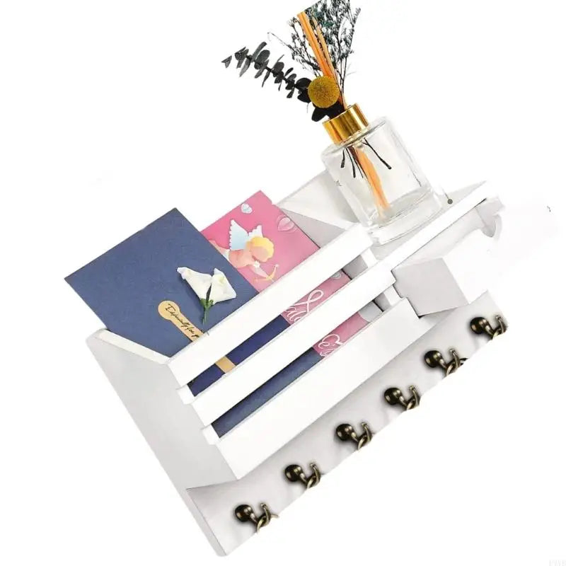 Rustic wall-mounted mail and key organizer with drawer featuring a glass bottle and decorative elements.