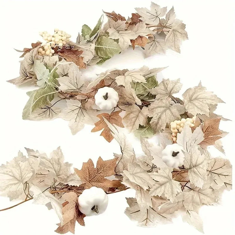 Dried artificial maple leaf vine garland featuring brown and pale green leaves and white berries for autumn decor