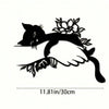 Black silhouette of a cat gently licking a hand, featuring floral accents, as Art Deco metal wall decor.