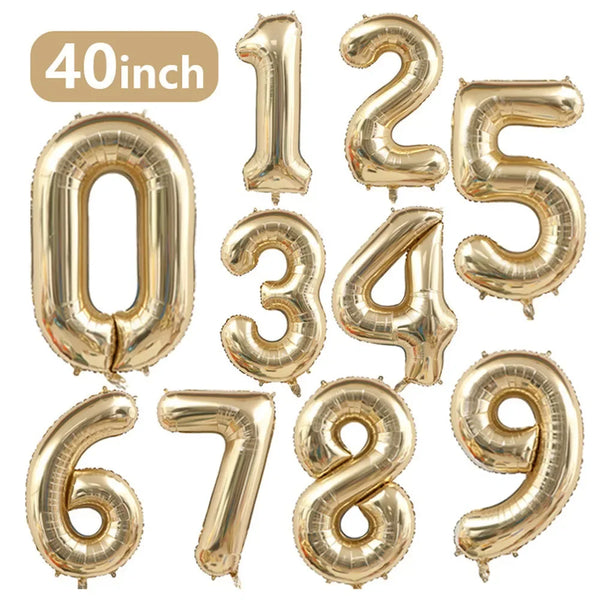 A set of gold foil number balloons spelling out 0123456789