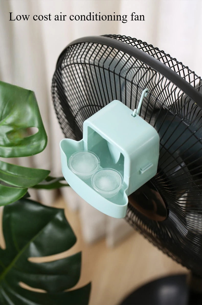 A light blue portable ice-cooling fan is shown in close-up against a blurred green plant background.