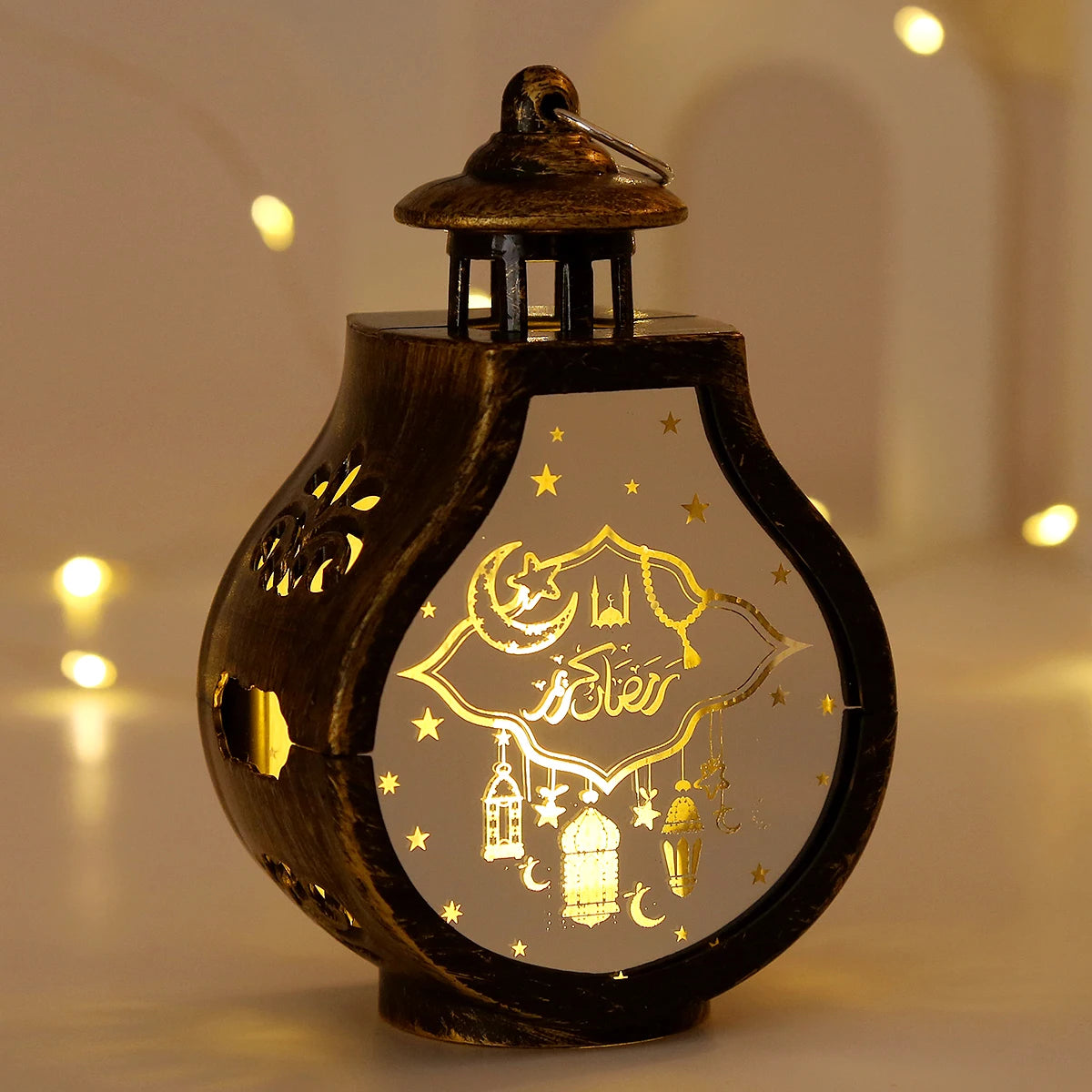 A dark wooden lantern with a glass dome featuring gold-colored Islamic motifs of stars, moons, and lanterns.