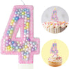 Pink glitter number 4 candle shaped like a cupcake with pink frosting