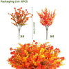 Four artificial autumn floral branches and a pile of colorful autumn leaves