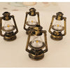 Three vintage ceramic miniature lanterns with brass frames and clear glass bulbs for dollhouse décor