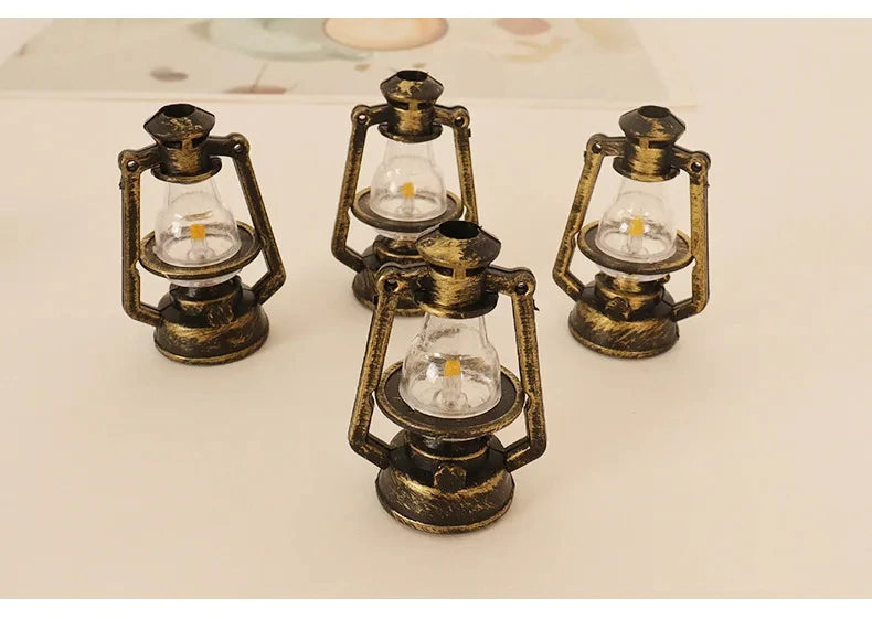 Three vintage ceramic miniature lanterns with brass frames and clear glass bulbs for dollhouse décor