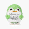 Handcrafted crochet penguin plush in green with an encouraging card inside
