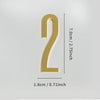 A polished gold house number shaped like the numeral 2 with a self-adhesive backing.