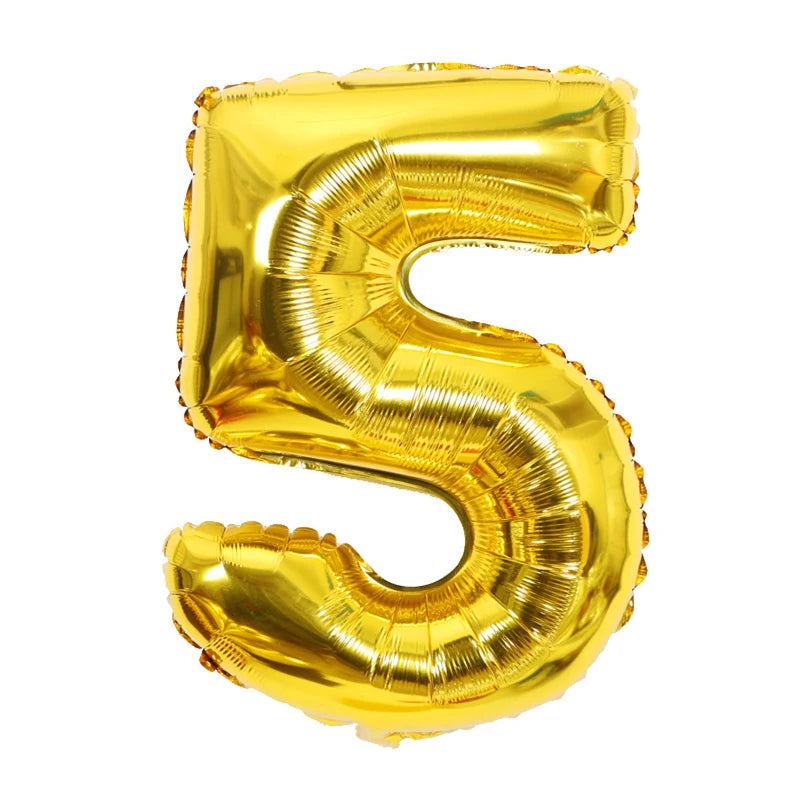 A shiny gold foil number balloon shaped like the numeral five.
