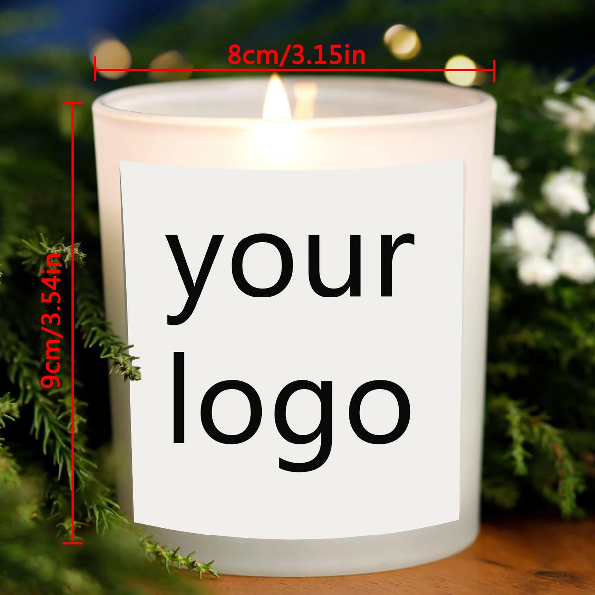 A white soy candle jar with a custom logo label is displayed in a natural green and white setting.