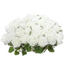 A bouquet of white velvet artificial roses with bendable stems for weddings and home decor.