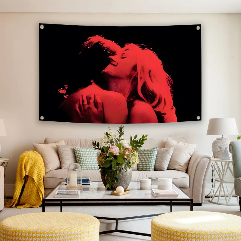 A red silhouette of a woman's face and hair is displayed on a black tapestry hanging above a light-colored sofa.