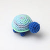 Handmade crocheted turtle plush with blue and light green scales