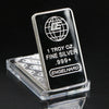 A silver bullion bar replica with a globe design and the text 1 Troy oz Fine Silver .999+ Engelhard