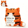 An orange tiger plush pendant with a card that reads Positive Cat You're Purr-fect
