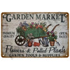 Vintage metal tin sign for a garden market featuring flowers, potted plants, and garden tools.
