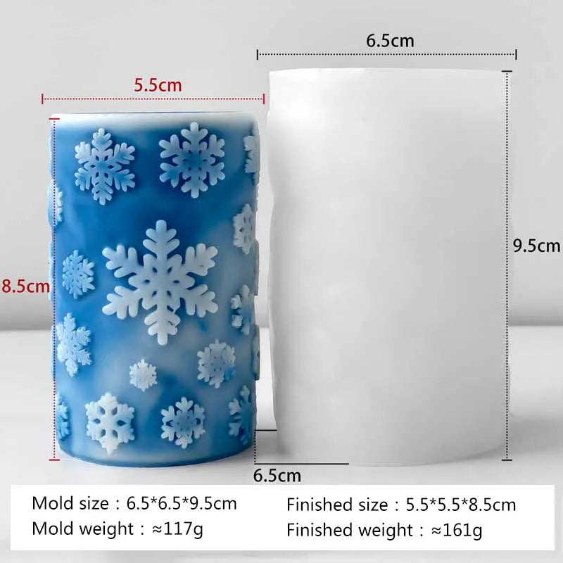 A blue silicone mold with white snowflake decorations and a finished white cylindrical product.