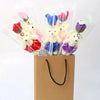 A bouquet of artificial rose soap bears shaped like teddy bears in various colors and packaging.