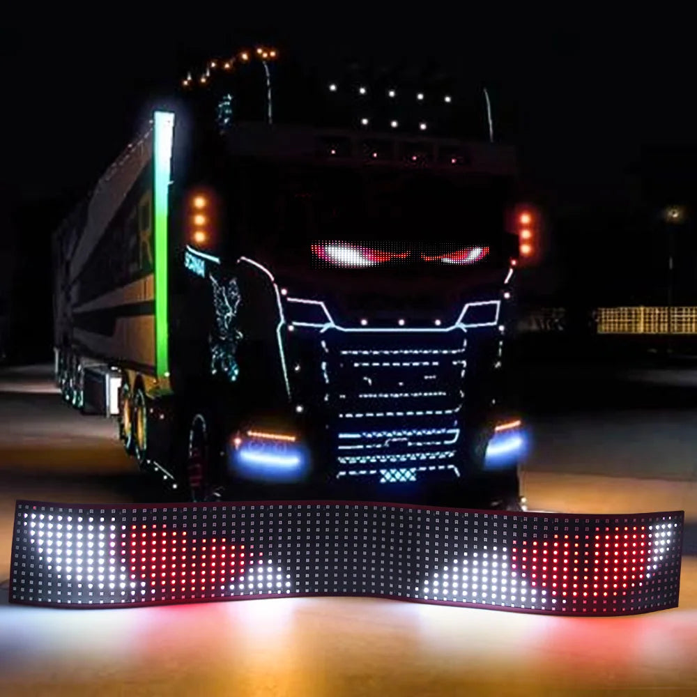 A black truck is illuminated by a flexible LED matrix display panel featuring red and blue lights.