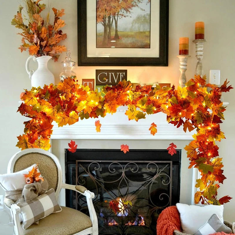 An autumn maple leaf artificial vine wreath displayed on a fireplace mantel with decorative seasonal decor.