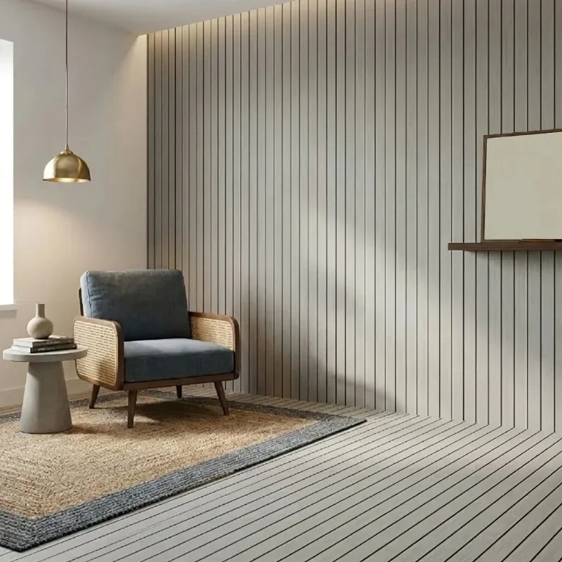 A modern interior featuring a light gray wall with vertical wood grain paneling, a blue armchair, and a light wooden shelf.