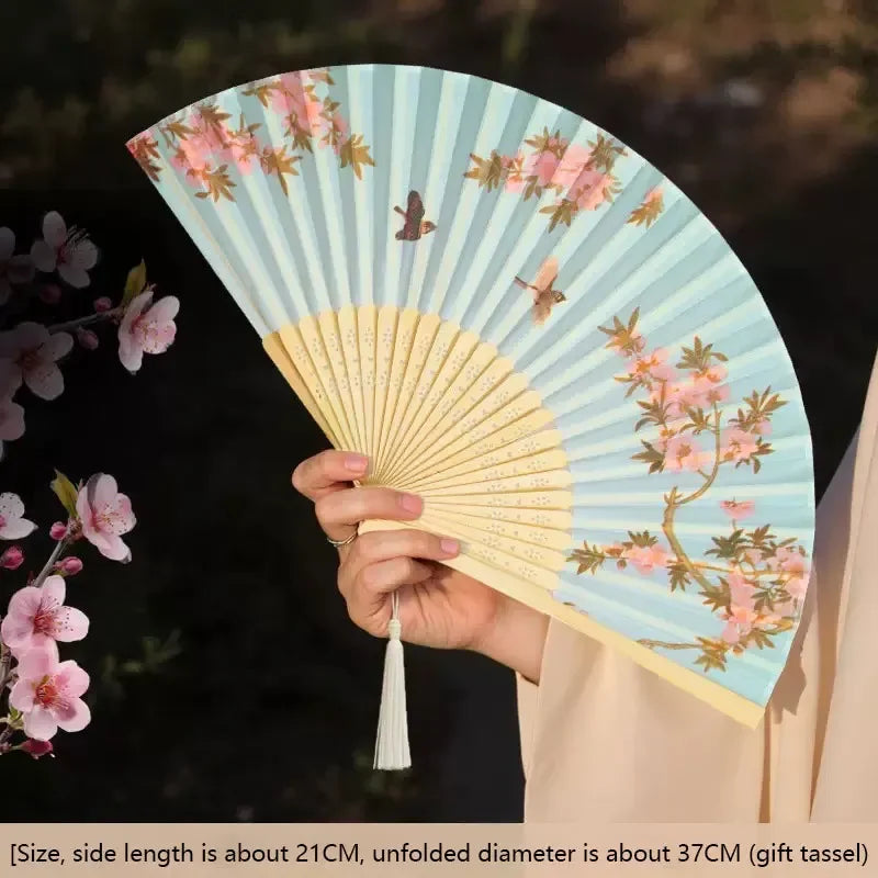 Elegant floral bird print bamboo folding fan with a light blue and yellow striped design