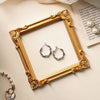 A vintage gold DIY shadow box frame with pearl accents displayed on a light background.