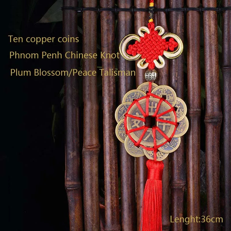 Ten copper coins and a plum blossom peace talisman pendant with a Chinese knot hanging from bamboo rods.