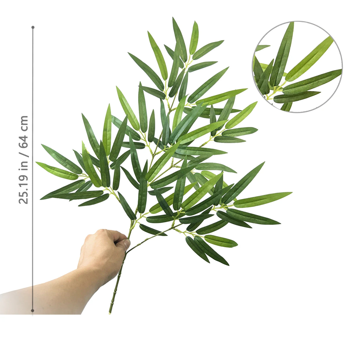 A branch of artificial bamboo with green leaves is shown, including a scale indicating 25.19 inches in or 64 cm.