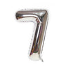 A metallic silver number foil balloon shaped like the number 7.