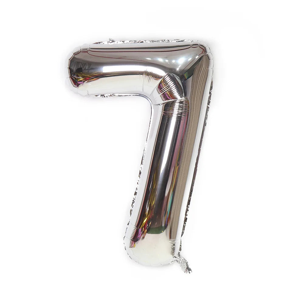 A metallic silver number foil balloon shaped like the number 7.