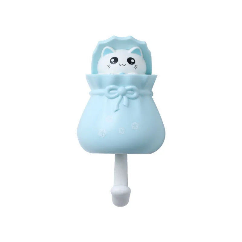 Light blue cartoon cat wall hooks for organization with a cute face design