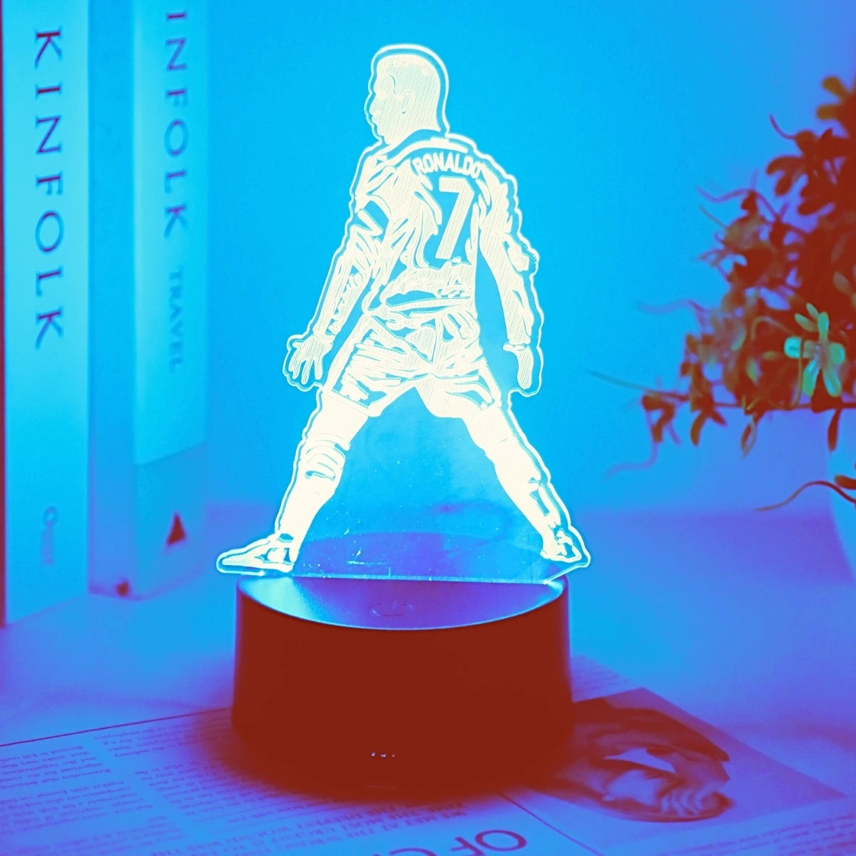 A glowing 3D football player figure with the number 7 stands on a dark base against a blue background.