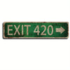 A rectangular, distressed green metal street sign with the text EXIT 420 and an arrow pointing to the right.