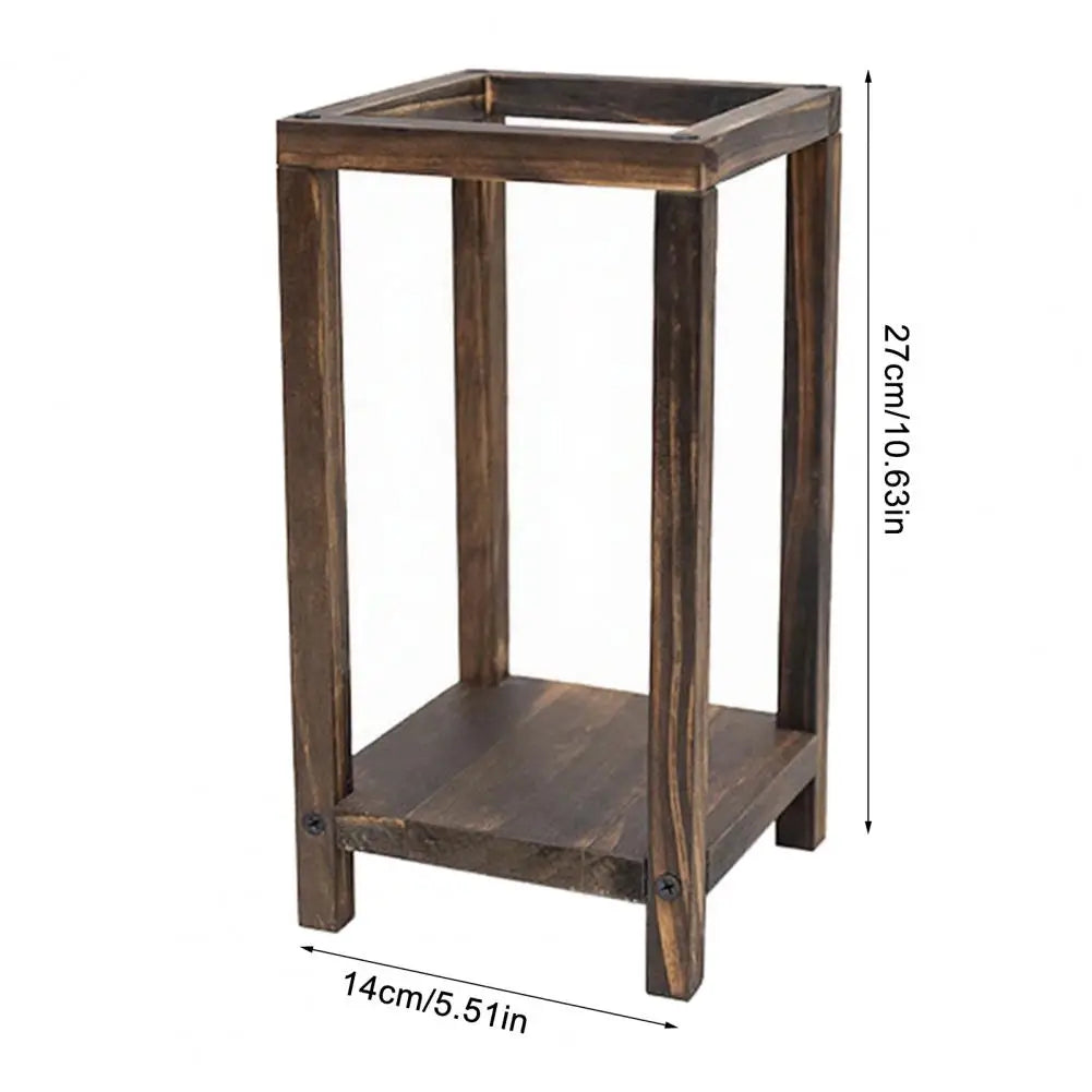 A rustic wooden candle holder lantern with a rectangular frame and square base.