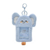 Light blue fluffy elephant keychain with a charm and a clip.
