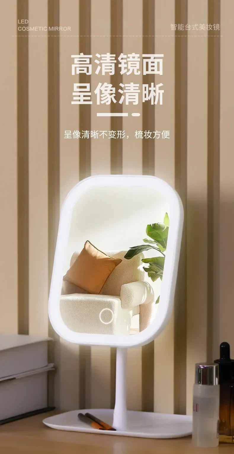 A white LED touch makeup mirror is shown displaying a clear reflection of a potted plant and soft lighting.
