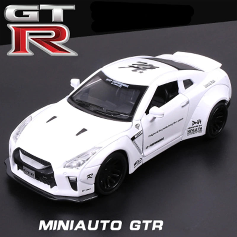 A white 1:32 scale diecast GTR sports car model with black wheels and detailing.