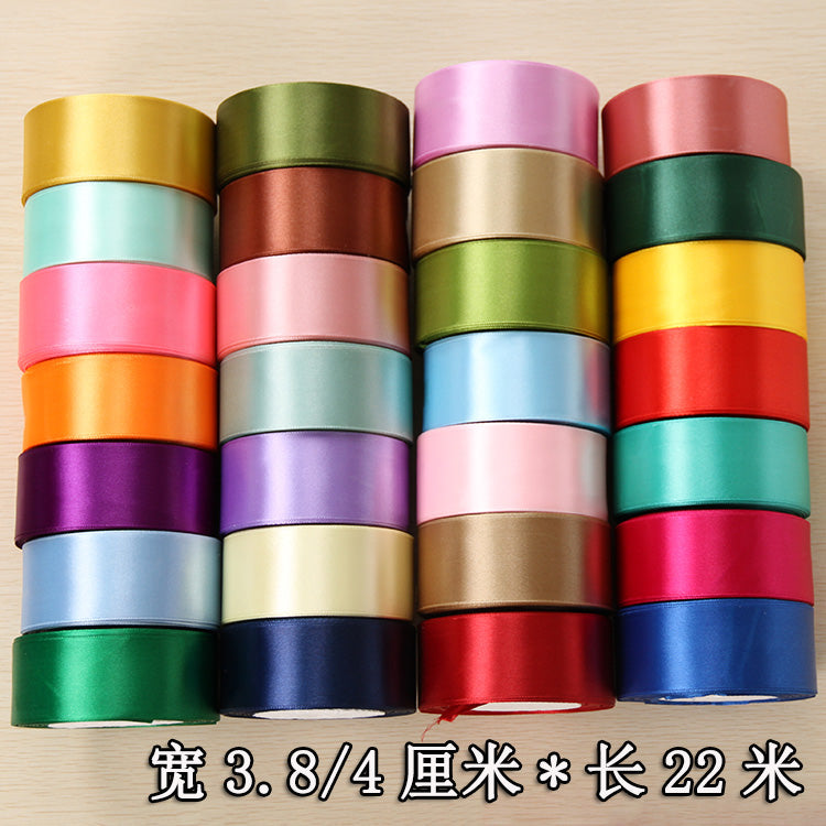 Rolls of silk satin ribbon in various colors and widths for gift wrapping and craft projects