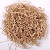 A pile of light brown crinkle cut paper shred filler material.